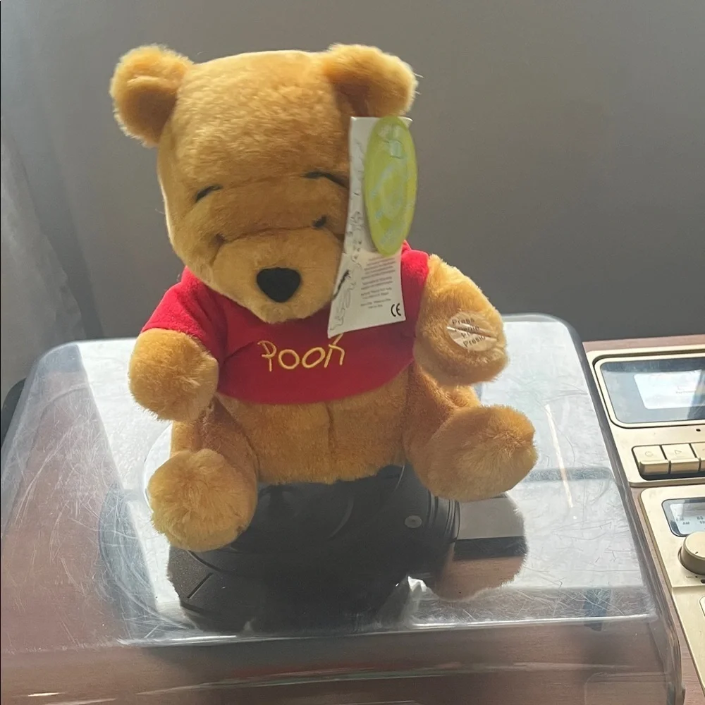 Winnie the Pooh plays song and moves!Charming Yellow and Red Stuffed Bear